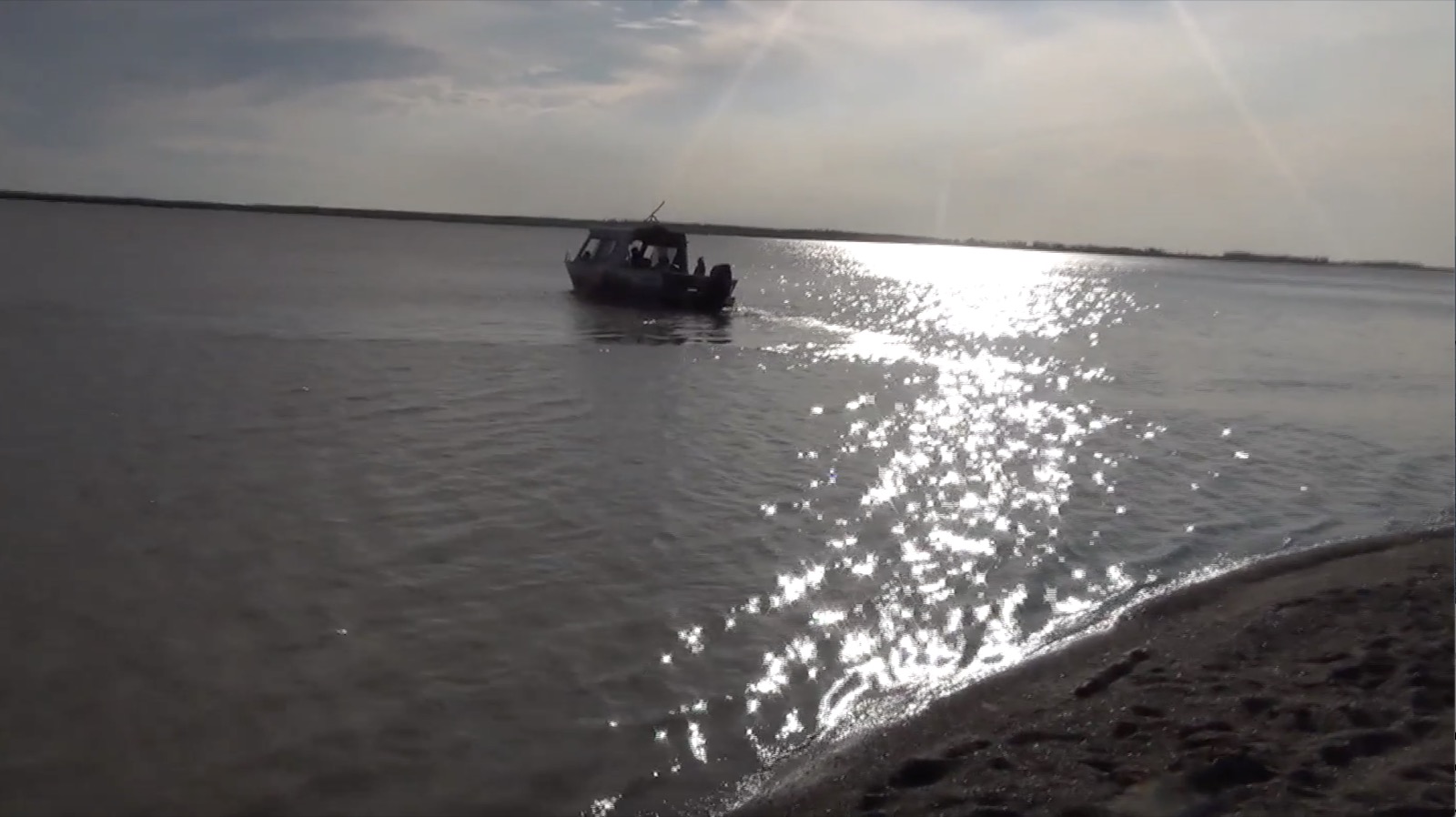 A boat leaving Terry Fossum above the Arctic Circle